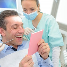 Patient in Nepean smiling after getting dental implants