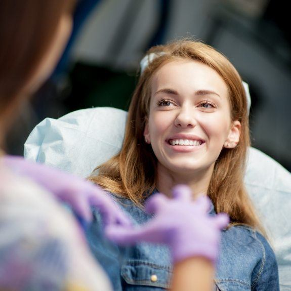 woman smiling at staff member