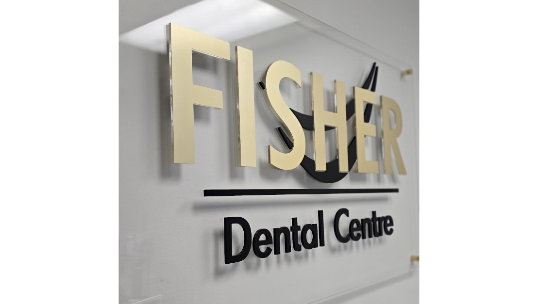 Fisher Dental office sign displayed in reception area