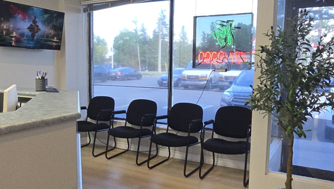 Reception and waiting area with large windows at Fisher Dental