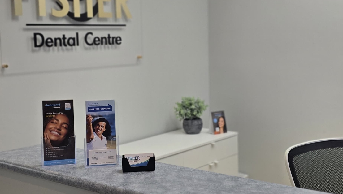 Reception desk and patient check-in area at Fisher Dental