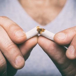 Man breaks cigarette