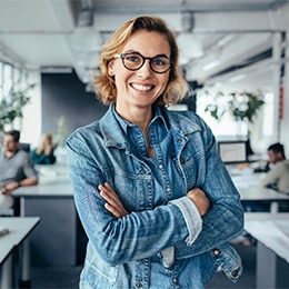 Young female professional smiling at work