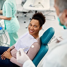 Young woman smiling at dentist’s office