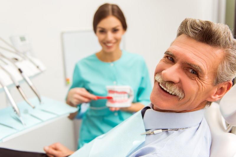 Patient smiling with their dentures
